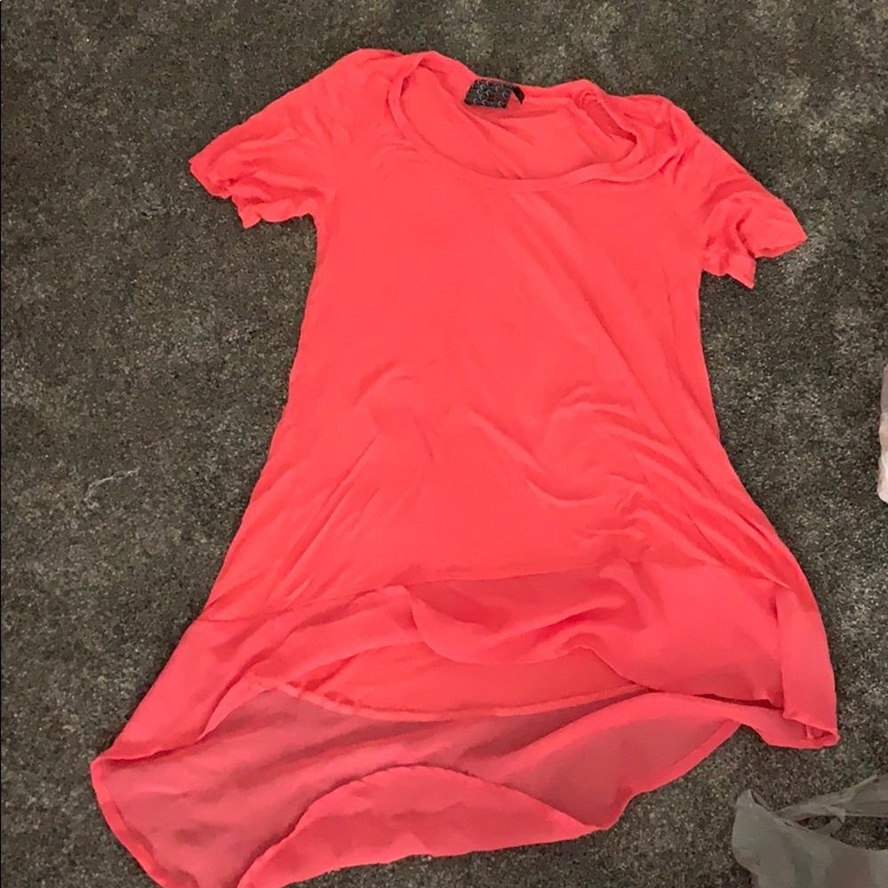 Small blouse with sheer tail.